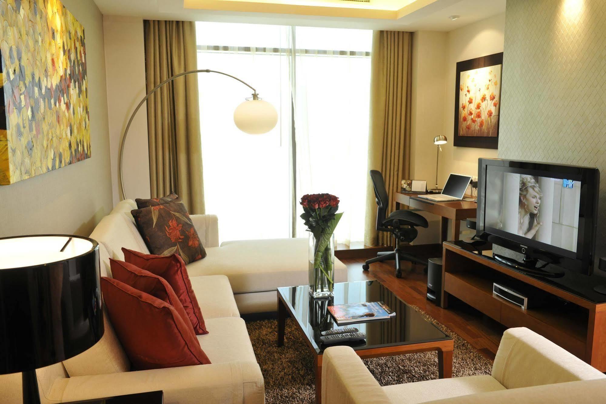Fraser Suites Seef Bahrain Manama Chambre photo A living room in a serviced apartment in Kuala Lumpur, Malaysia